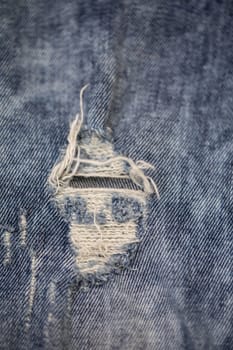 The intricate frayed denim texture prominently showcases a highly unique and original design element