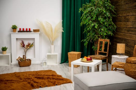A stylish living room with wicker furniture and vibrant greenery, creating a warm and cozy atmosphere