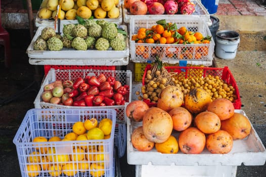 assortment of tropical exotic fruits at the Asian food market in Asia in Vietnam. Vietnamese ripe sweet fruits