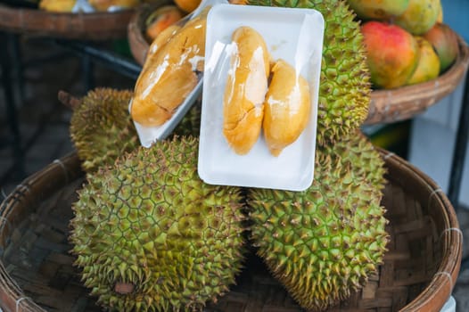 Durian fruit on the counter at the Asian food market in Asia in Vietnam