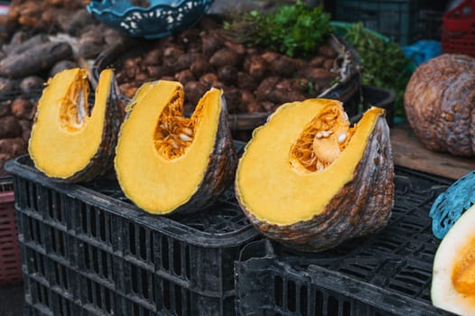 sliced pumpkin slices at a street vegetable grocery market