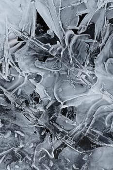 Frozen stream and ice closeup photo. Beautiful winter abstract background in nature. Concept for water and winter time