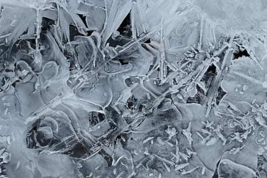 Frozen stream and ice closeup photo. Beautiful winter abstract background in nature. Concept for water and winter time