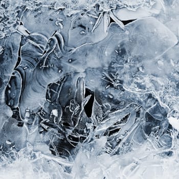 Frozen stream and ice closeup photo. Beautiful winter abstract background in nature. Concept for water and winter time