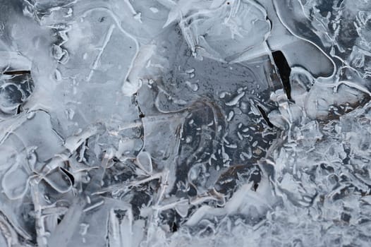 Frozen stream and ice closeup photo. Beautiful winter abstract background in nature. Concept for water and winter time