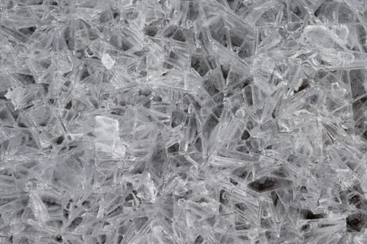 Frozen stream and ice closeup photo. Beautiful winter abstract background in nature. Concept for water and winter time