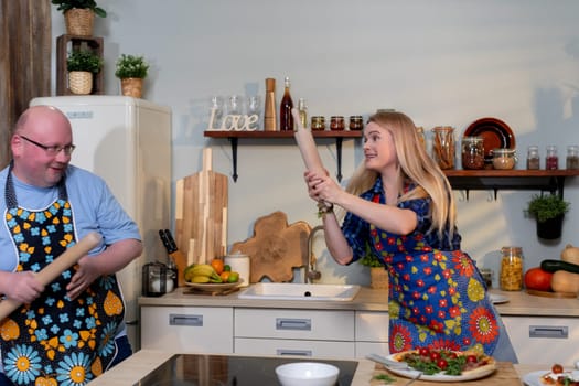 In a lighthearted cooking moment, passionate chefs joyfully enjoy having fun together in a vibrant, colorful kitchen