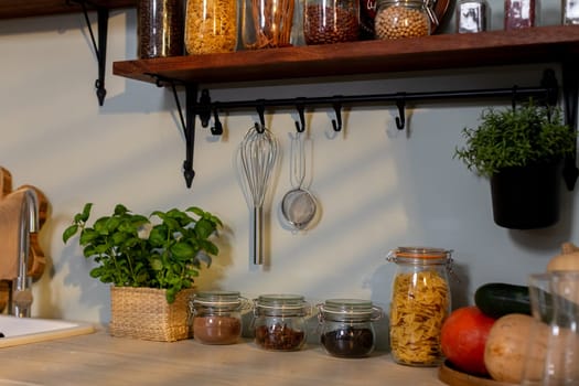 A cozy and warm kitchen scene filled with jars, vibrant herbs, and charming rustic decor for culinary inspiration