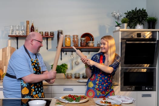 A vibrant, lighthearted kitchen scene depicting chefs joyfully having fun while cooking and collaborating together