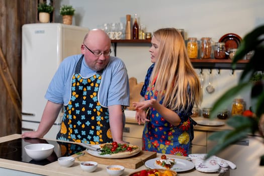 In a lively kitchen, a duo shares their culinary skills while preparing fresh and delicious dishes together