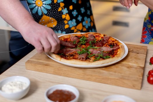 Engage in a delightful handson experience of crafting a mouthwatering pizza with an array of fresh toppings