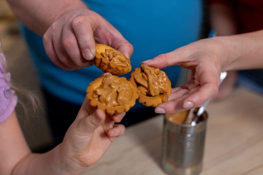 Families creating strong bonds over delicious homemade cookies, capturing joy, love and togetherness in the kitchen