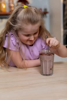 A joyful child enjoys a delicious chocolate milkshake, embodying the essence of childhood happiness
