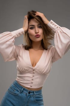 portrait view of young female model in stylish posing on camera