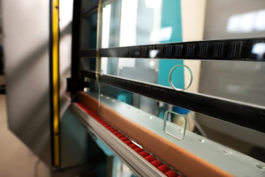 Contemporary professional equipment for cut and polish glass in space of industrial workplace