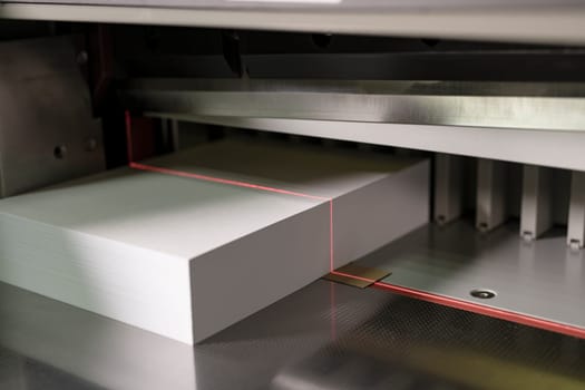 Contemporary cutting paper equipment for production notepads with laser line and metal details
