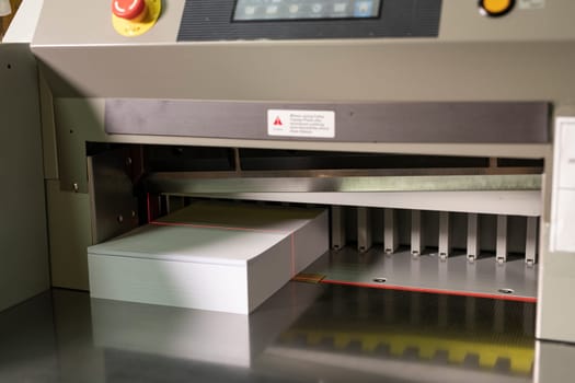 Contemporary cutting paper equipment for production notepads with laser line and metal body