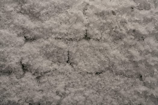 brick wall in ice and frost - cold winter concept background