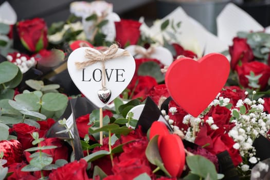 Red roses and heart-shaped decorations celebrate love and affection.