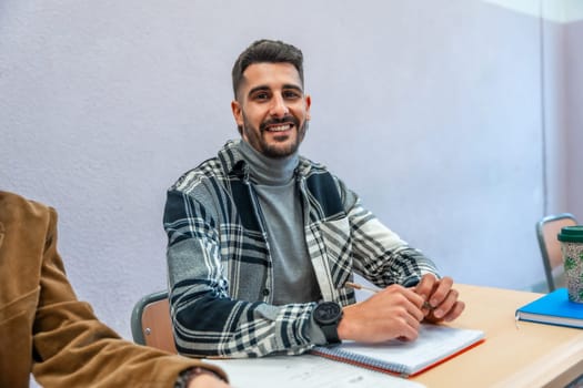 Smiling university student engaging in studying and taking notes during a lecture, immersed in learning and academic growth
