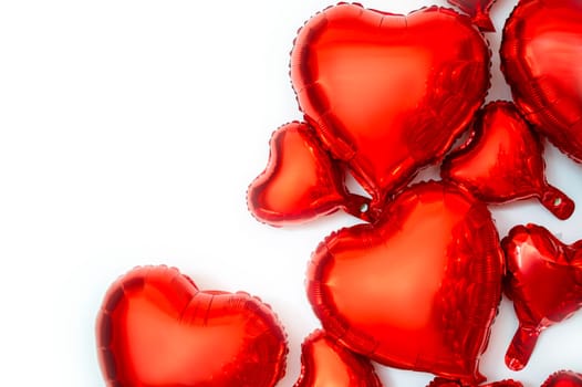 frame for text and foil balloons in the shape of hearts. balloons of various sizes from large to small hearts. balloon hearts are located on the right side of the background.