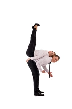 Full body side view of confident businessman carrying female partner on shoulder as concept of cooperation with notebook and cell phone