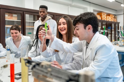 Diverse group of university chemistry students conducting an experiment in a lab, using lab coats and equipment, showcasing teamwork and scientific inquiry