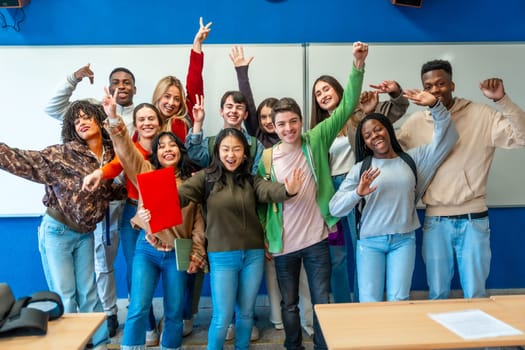 Multi ethnic university students celebrating their academic achievements inside classroom