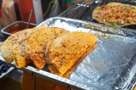 Vietnamese banh Xeo pancakes at an Asian street market in Vietnam. Traditional Vietnamese street food