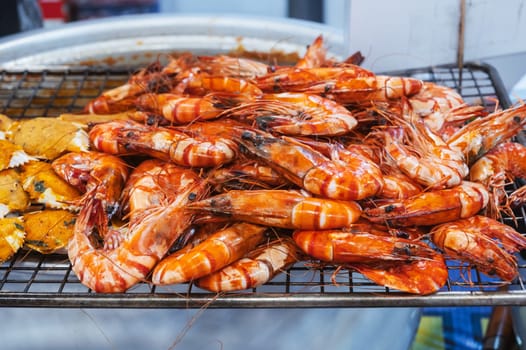 Grilled shrimps at an Asian night market in close-up. Traditional street food in Asia in Vietnam