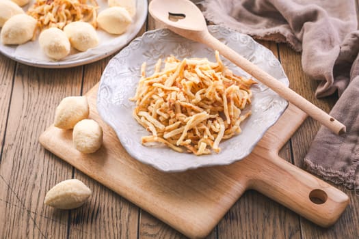 Semolina dumplings and pancake noodles for soup, preparing broth with noodles