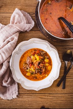 Zero waste soup, pizza soup with vegetables, mushrooms and minced meat, minestrone