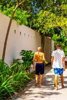 Two friends tourists in the tropical nature in Playa del Carmen Quintana Roo Mexico.