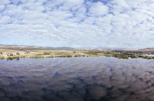Dunrobin Bridge views of Meadowbank Lake and River Derwent on a cool summer's morning near Ouse in Tasmania, Australia