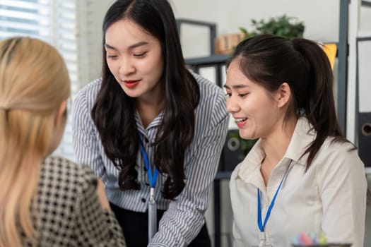 A professional team collaborates on tax analysis and planning, showcasing effective communication and teamwork in a business setting.