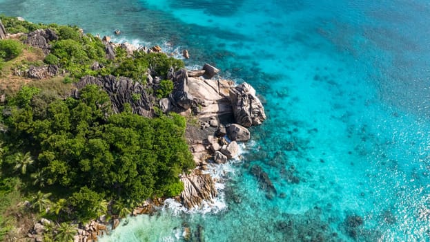Top view of hidden beach with turquoise water. La Digue, Seychelles.