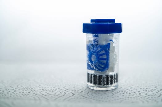 close-up of a container for cleaning and storing contact lenses for the eyes. used at home. For soft and hard lenses. in the container there is an active cleaning process, bubbles are released.