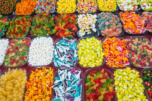 assortment of marmalade and chewable candies on the counter at a candy store in oriental market