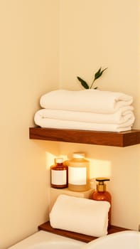 Spa treatment set, wooden shelf with neatly folded towels and dispensers for soap, cream, massage oil. High quality photo