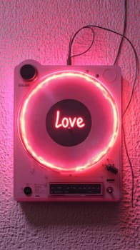 A top-down view of a white record player with a glowing pink neon light circling the disc, which displays 'Love'. The scene is bathed in a pink light, evoking a romantic, musical atmosphere.
