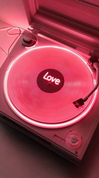 Close up shot of a record player with a vinyl record illuminated by neon lights. The center of the record displays the word 'Love', adding a thematic touch to the artistic composition.