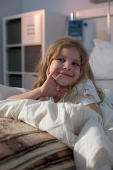 A cheerful girl is happily relaxing on a cozy bed, radiating joy and curiosity in a warm environment