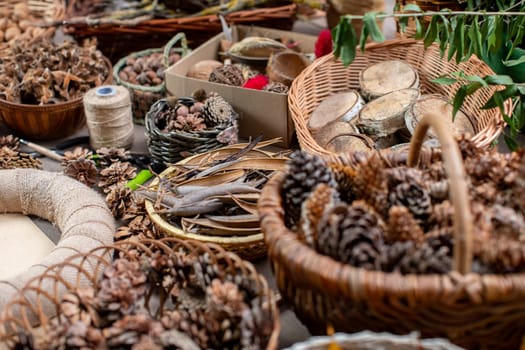 A collection of pine cones and natural items displayed in woven baskets, perfect for nature-inspired decor.