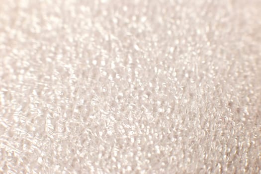 Macro plastic foam texture in white. Selectiv focus. Copy space