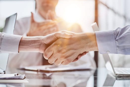 Extreme Closeup of Two Men Shaking Hands