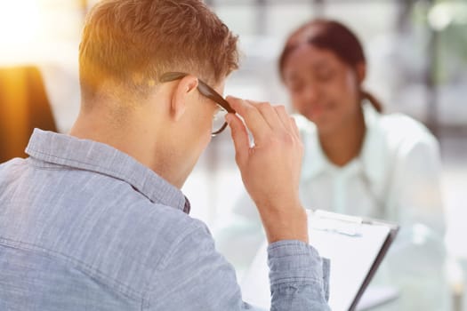 Smiling businesswoman taking interview of a job applicant