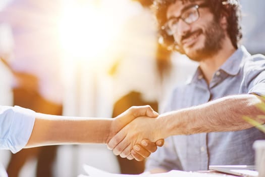 Business professionals in a successful meeting, displaying teamwork and collaboration.