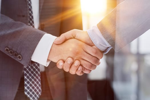Close up of handshake in the office