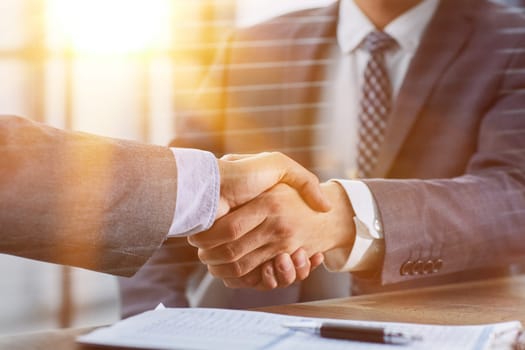 Close up of handshake in the office
