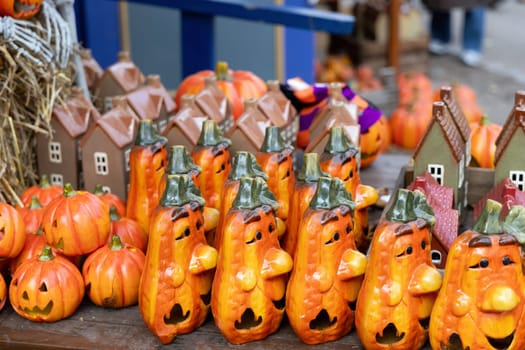 Halloween decorations and souvenirs, funny pumpkins and houses in a small shop.